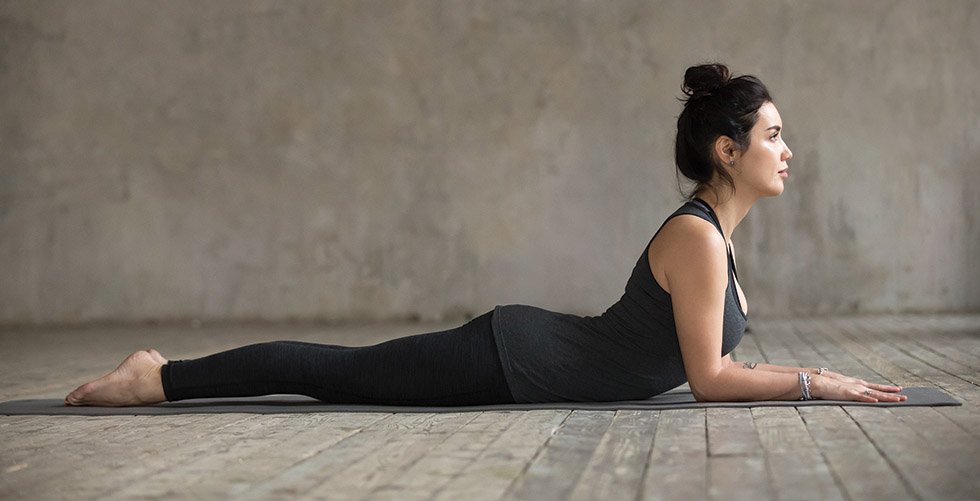 Young woman doing Sphinx exercise